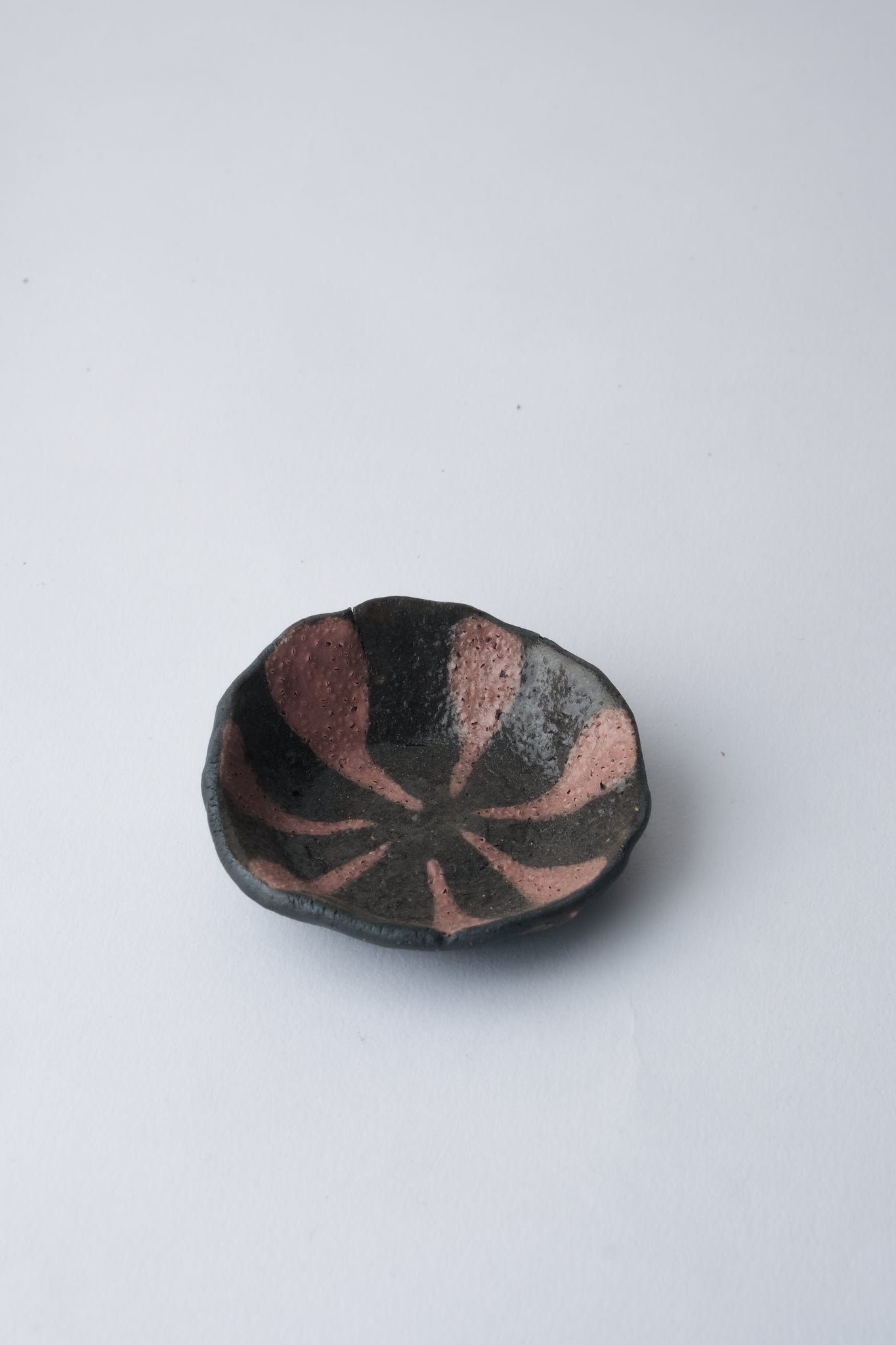 1/1 – Small Black Jewelry Plate with Striped Pink Underglaze